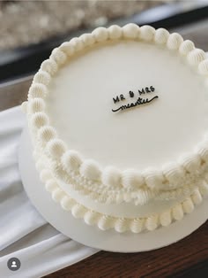 a wedding cake with the word mr and mrs on it
