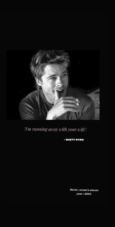 a black and white photo of a man with his hand on his mouth in front of him