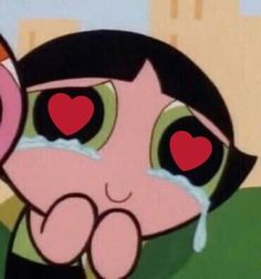 a cartoon character with big eyes holding a heart in front of her face and looking at the camera