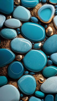 blue and gold pebbles are arranged on top of each other