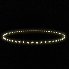 a circular light with stars on it in the dark