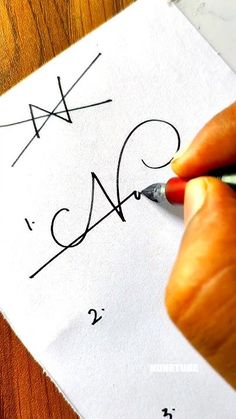 someone is writing numbers on a piece of paper