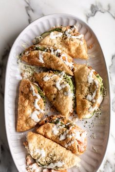 some food is on a white plate on a marble table
