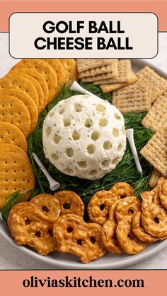 a plate with crackers, pretzels and cheese ball on it for a game day appetizer