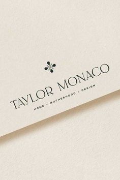 the logo for taylor monaco is displayed on a piece of white paper with black lettering