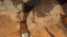 a person standing on the ground with their feet up