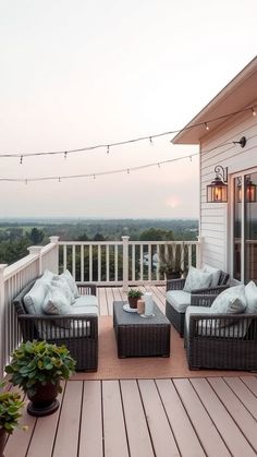 an outdoor patio with wicker furniture and string lights