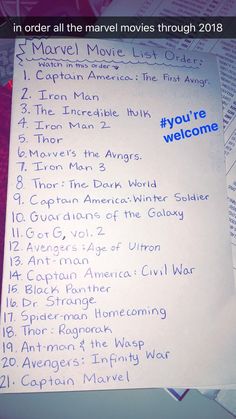 the menu for an upcoming movie is displayed on a table with other items in front of it