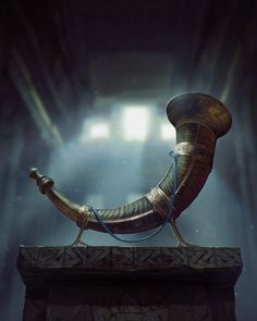 a large metal object sitting on top of a wooden block in the middle of a room