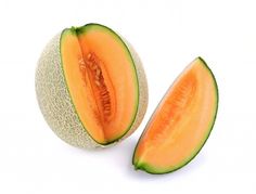 a melon cut in half on a white background