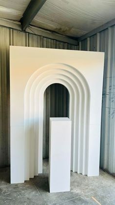 a white sculpture sitting in the middle of a room
