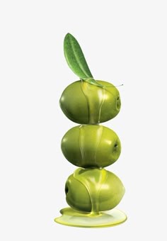 three green apples stacked on top of each other with a leaf sticking out of them