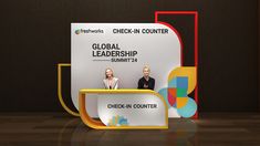 two people standing in front of a sign with the words global leader summit on it