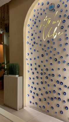 the entrance to an upscale hotel with blue and white decorations