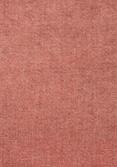 a red and white fabric textured with herringbones