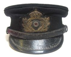 an old black hat with a gold crown on it