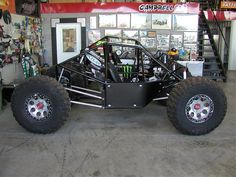 a monster truck is parked in a garage