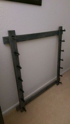 there is a wooden rack in front of the wall