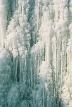 an aerial view of icicles on the side of a mountain