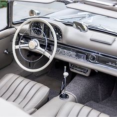 the interior of an older model car is clean and ready for customers to ride in