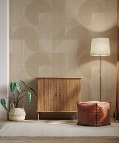 a wooden cabinet sitting next to a lamp on top of a table