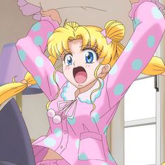 a woman with blonde hair and blue eyes wearing pink pajamas