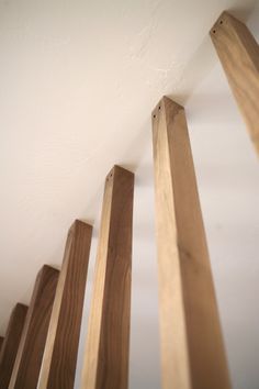 wood beams are lined up against the wall