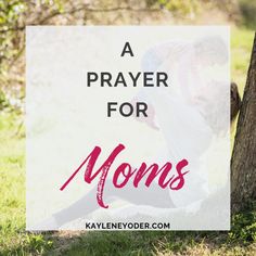 a mother and her child are sitting in the grass under a tree with text overlay that reads, a prayer for moms