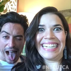 a man and woman making funny faces with their mouths open in front of the camera