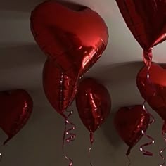 red heart shaped balloons hanging from the ceiling
