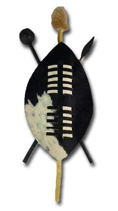 a black and white leaf shaped object with two wooden sticks sticking out of it's side