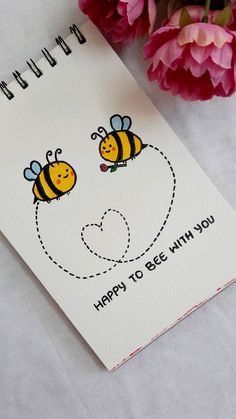 a card with two bees on it next to some pink flowers and a red carnation