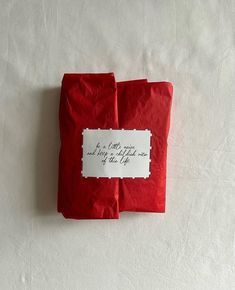 two red napkins with white writing on them