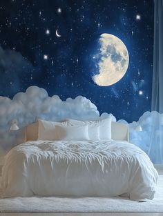 a large bed sitting under a night sky filled with stars and the moon above it