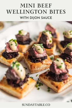 mini beef wellington bites on a white plate with green garnish and text overlay
