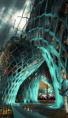 a man is standing in front of a futuristic building with trees growing out of it