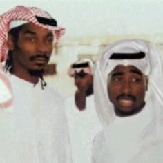 two men are standing next to each other