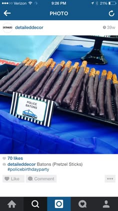 an image of food on a table with blue cloths and place cards for sale