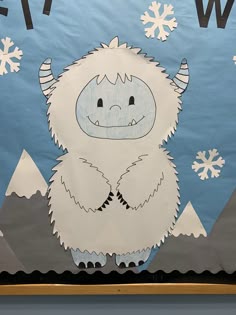 a paper cut out of a furry animal with snowflakes