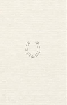 a drawing of a horseshoe on the side of a white paper with an outline of a horse's head
