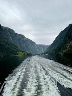 the wake of a boat traveling down a river