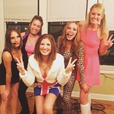 the girls are all dressed up and posing together