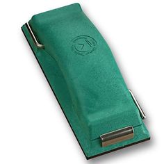 a green leather case with a metal clip
