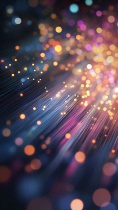 an abstract background with blurry lights and bokems in blue, pink, yellow and purple colors