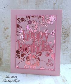 a pink birthday card with flowers on it
