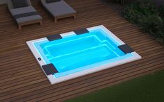 an above ground swimming pool in the middle of a decked area with chaise lounges