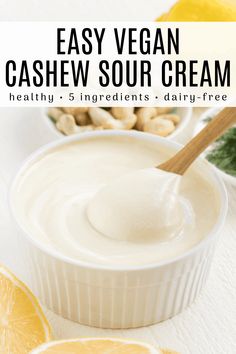 an easy vegan cashew sour cream in a bowl with lemons and nuts
