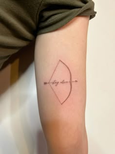 a person with a small tattoo on their arm
