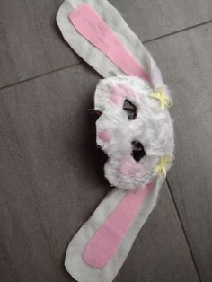 a stuffed animal bunny is laying on the floor