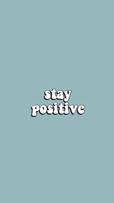 the words stay positive written in white on a blue background with black and white lettering